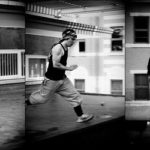 Parkour practitioners training precision jumps indoors